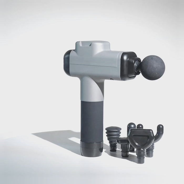 Gray 30 Speed Pulse and Cotton massage gun rotating 360 degrees, shown with its 6 interchangeable heads